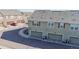 Aerial view of townhome garages, street, and nearby units in an established neighborhood at 12783 Leyden St # E, Thornton, CO 80602