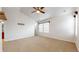 Bright bedroom with neutral walls, carpeted floors, and multiple windows offering lots of natural light at 12783 Leyden St # E, Thornton, CO 80602