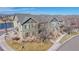 A picturesque view of the townhome units with a view of the lake and snow-capped mountains in the distance at 12783 Leyden St # E, Thornton, CO 80602