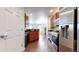 Updated kitchen with stainless steel appliances, dark countertops, and beautiful cabinetry at 12783 Leyden St # E, Thornton, CO 80602