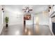 Bright living room with hardwood floors and seamless open-concept design at 12783 Leyden St # E, Thornton, CO 80602