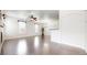 Bright, open living area with hardwood floors and large windows at 12783 Leyden St # E, Thornton, CO 80602