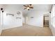 Large main bedroom with a ceiling fan, shelving, and walk-in closet at 12783 Leyden St # E, Thornton, CO 80602