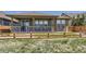 Back porch with wooden fence, providing an inviting outdoor space at 6614 Club Villa Rd, Parker, CO 80134