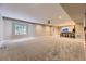 Large finished basement featuring carpet and a bar area for entertaining at 6614 Club Villa Rd, Parker, CO 80134