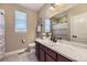 Bathroom featuring a single sink vanity, mirror and a shower with curtain at 6614 Club Villa Rd, Parker, CO 80134