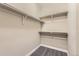 Walk-in closet featuring painted walls, carpet and shelf space for storage at 6614 Club Villa Rd, Parker, CO 80134