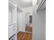 Spacious closet with mirrored wall and ample shelving and storage space at 8555 Fairmount Dr # D204, Denver, CO 80247