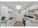 Efficient kitchen with white appliances, ample cabinet space, and a practical design at 8555 Fairmount Dr # D204, Denver, CO 80247