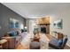 Inviting living room featuring a stone fireplace, comfortable seating, and stylish decor at 8555 Fairmount Dr # D204, Denver, CO 80247