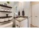 Bathroom featuring granite countertops, shelving and neutral tones at 18270 E 51St Pl, Denver, CO 80249