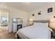 Comfortable bedroom featuring a vanity, decor, and neutral tones at 18270 E 51St Pl, Denver, CO 80249