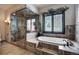 Luxurious bathroom with a glass shower, soaking tub and vanity at 118 Gold Piece Dr, Breckenridge, CO 80424