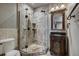 Elegant bathroom with glass shower, stone tile, and carved wood vanity at 118 Gold Piece Dr, Breckenridge, CO 80424