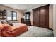Spacious bedroom with large window, dark wood trim, and plush carpet at 118 Gold Piece Dr, Breckenridge, CO 80424