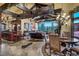 Open-concept living space with a kitchen, dining area, and comfortable seating area with mountain vistas at 118 Gold Piece Dr, Breckenridge, CO 80424