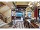 Elegant living and dining area with stone floors, wooden beams, and mountain views at 118 Gold Piece Dr, Breckenridge, CO 80424