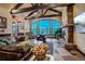 Living room features large windows, vaulted ceiling and stone fireplace at 118 Gold Piece Dr, Breckenridge, CO 80424