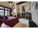 Luxurious main bedroom suite with a fireplace, chandelier, and ample space for relaxation and comfort at 118 Gold Piece Dr, Breckenridge, CO 80424