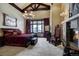 Elegant main bedroom featuring a cozy fireplace, plush bedding, and a serene atmosphere for restful nights at 118 Gold Piece Dr, Breckenridge, CO 80424