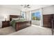 Spacious main bedroom features large bed, ample natural light, and stylish furnishings at 2470 Robindale Way, Castle Rock, CO 80109