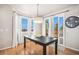 Bright dining area with a large window, sliding glass door, and a modern light fixture, perfect for Gathering meals at 2470 Robindale Way, Castle Rock, CO 80109