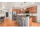 Open kitchen with a central island, stainless steel appliances, and abundant cabinet space for efficient meal preparation at 2470 Robindale Way, Castle Rock, CO 80109