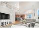 Spacious living room with a high ceiling, views to the kitchen, comfortable seating, and natural light at 2470 Robindale Way, Castle Rock, CO 80109