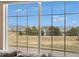 Expansive window showcases scenic mountain views and lush greenery at 2470 Robindale Way, Castle Rock, CO 80109