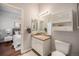 Cozy bathroom featuring a single vanity, medicine cabinet, and modern fixtures in this unit near the main bedroom at 277 N Broadway # 202, Denver, CO 80203