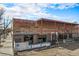 Exterior of Punch Bowl Social with brick facade and outdoor seating area at 277 N Broadway # 202, Denver, CO 80203