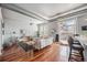 Modern living room featuring hardwood floors, a ceiling fan, and a private balcony with great city views at 277 N Broadway # 202, Denver, CO 80203