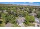 Aerial view of home in a lush neighborhood, showcasing the well-manicured lot and surrounding trees at 10247 W Roxbury Pl, Littleton, CO 80127