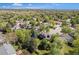 Aerial shot of a house showcasing mature trees and the surrounding neighborhood at 10247 W Roxbury Pl, Littleton, CO 80127
