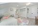 Inviting bedroom with closet and vanity area, offering space for personal touches at 10247 W Roxbury Pl, Littleton, CO 80127