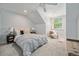 Cozy bedroom featuring a large bed, soft carpet and a window for natural light at 10247 W Roxbury Pl, Littleton, CO 80127
