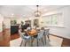 Bright dining area featuring a stylish light fixture, modern furnishings, and natural light, ideal for Gathering meals and entertaining at 10247 W Roxbury Pl, Littleton, CO 80127