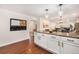 Spacious kitchen featuring granite countertops, stainless steel appliances, and modern pendant lighting at 10247 W Roxbury Pl, Littleton, CO 80127