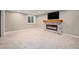 Comfortable living area with a fireplace and TV, perfect for relaxation at 10247 W Roxbury Pl, Littleton, CO 80127
