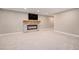 Spacious living room with a fireplace and TV, ideal for entertaining at 10247 W Roxbury Pl, Littleton, CO 80127