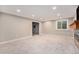 Bright living room with a fireplace, TV and window, creating a cozy atmosphere at 10247 W Roxbury Pl, Littleton, CO 80127