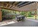 Outdoor patio with table and chairs for dining and entertaining guests at 10247 W Roxbury Pl, Littleton, CO 80127