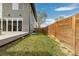 Backyard with a privacy fence and lush green grass at 3000 S Elati St, Englewood, CO 80110