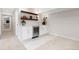 Stylish bar area with sleek countertops, wine fridge, and modern cabinetry at 3000 S Elati St, Englewood, CO 80110