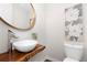 Modern powder room with a unique sink and stylish decor at 3000 S Elati St, Englewood, CO 80110