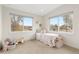 Cozy bedroom featuring bright windows and playful decor, perfect for a  at 3000 S Elati St, Englewood, CO 80110