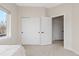 Bedroom with large closet and ample natural light, offering functional space at 3000 S Elati St, Englewood, CO 80110