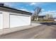 Detached garage with an expansive driveway at 3000 S Elati St, Englewood, CO 80110