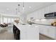 Modern kitchen with a large marble island, stainless steel appliances, and an open layout at 3000 S Elati St, Englewood, CO 80110