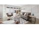 Stylish living room featuring modern decor and an expansive sliding glass door to the outside patio at 3000 S Elati St, Englewood, CO 80110